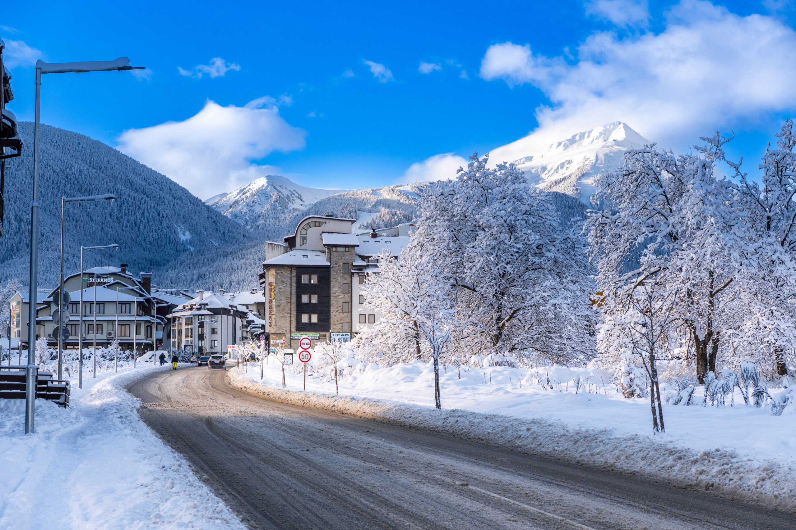 Snowy street in Bansko with mountain views